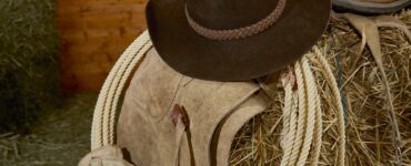 Hat and rope on hay bale